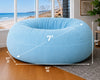 Blue bean bag chair with dimensions in a room with a beach view